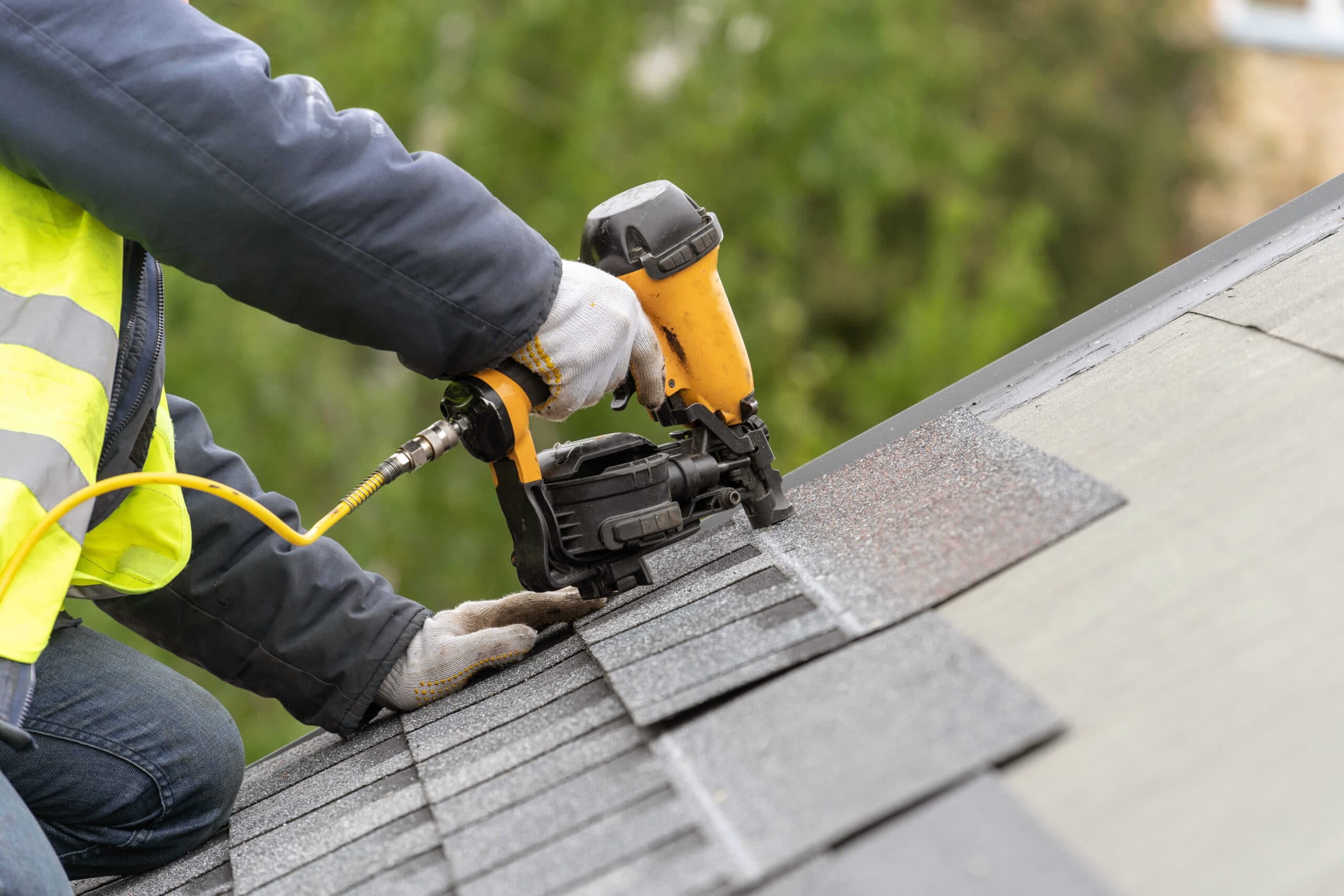 EZ Roofing crew installing new architectural shingles in Springfield, MO